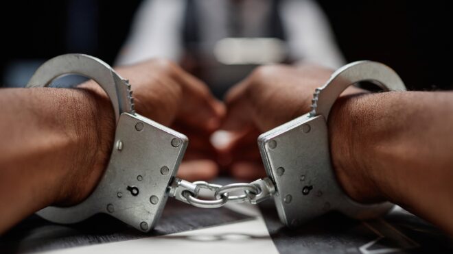 Hands in handcuffs